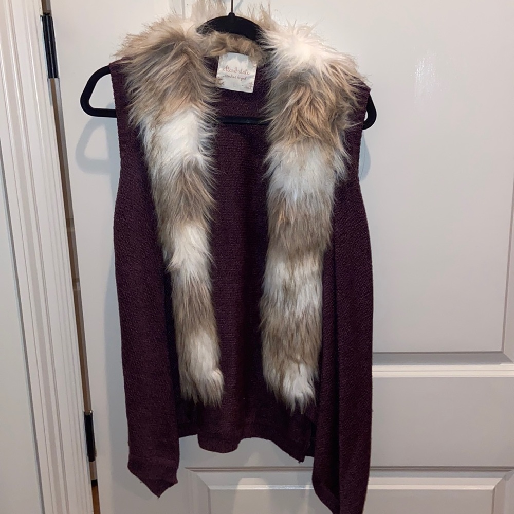 Alter’d state. Maroon sweater vest with fur around collar. Size large.